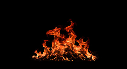 Fototapeta premium Captivating display of vibrant flames against a stark black background creates drama