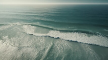 Obraz premium Tranquil Seascape Capturing the Gentle Waves and Vast Horizon of the Ocean Under a Serene Sky, Evoking Peace and Natural Beauty.