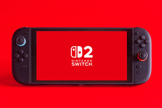 Fukuoka, Japan - june 7, 2025 : nintendo switch 2 game console isolated on red background