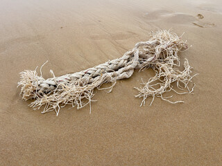 Abandoned fishing net on the beach, closeup of photo