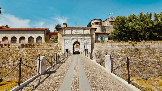 Fortified battlements and corner towers crown the hillside at Brescia Castle, Brescia, Lombardy, Italy