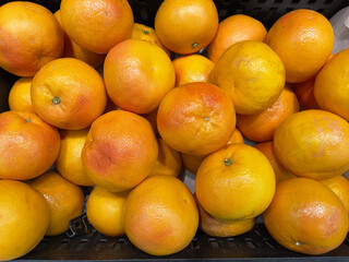 Grapefruit in a supermarket, close-up photo with selective focus