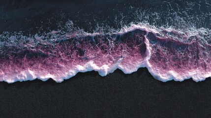 Serene ocean wave with purple hues breaking on dark sand beach, a breathtaking coastal scene.