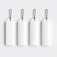 Four blank price tags hanging on a simple background, perfect for product labeling or creative projects.