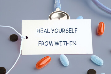 The concept phrase HEAL YOURSELF FROM WITHIN. Heal yourself, mental health, absent-minded, feeling...