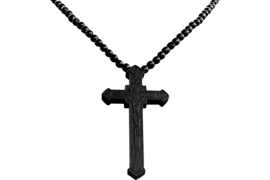 Close up of a black cross pendant necklace with dark beads on a black background in a studio shot