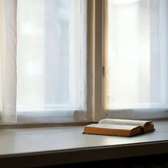 Book resting on white windowsill with morning sun shining through curtain, peaceful mood