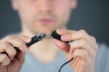 administrator holding network cables connected to servers