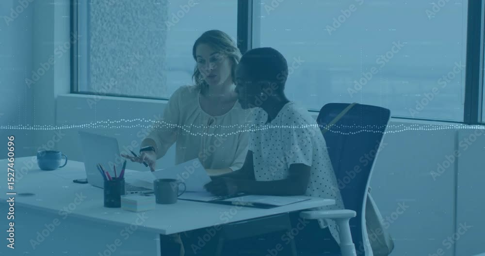 Poster business colleagues sliding sheet and tapping trackpad while reviewing document changes by window