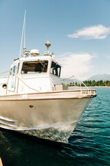 Close-up of docked utility boat on clear blue water, Vancouver Harbor