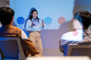 Businesswoman explaining colleagues during meeting and discussion business plan with coworker shareholder,discussing roadmap to product launch in office.planning,strategy,business development concept