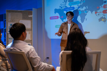 Businessman explaining colleagues during meeting and discussion business plan with coworker shareholder,discussing roadmap to product launch in office.planning,strategy,business development concept