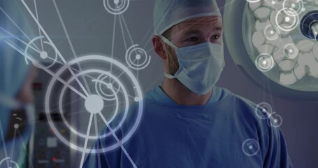 Surgical team tracking pulsing data overlay while colleague joining and interpreting metrics in OR - Powered by Adobe