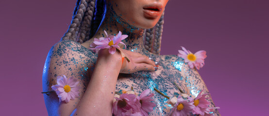 Woman body parts with  medical plaster holds flowers. Closeup face of young beautiful woman with a healthy  skin. Body care and health concept