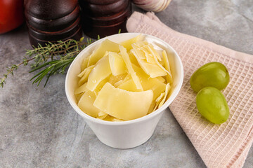 Parmesan cheese slices in the bowl