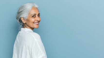 Senior Arabian woman smiling isolated on pastel background for retirement concept