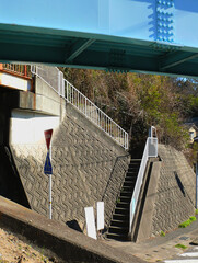 Concrete staircases leading to the road from the upper residential area.
This is a view from a...