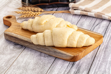 Raw uncooked croissant for bake