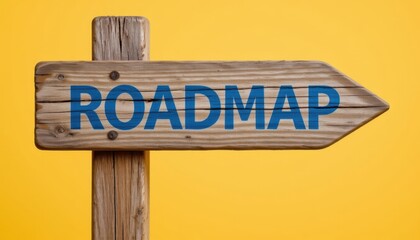 Obraz premium Wooden Signpost with Roadmap Text on Bright Yellow Background
