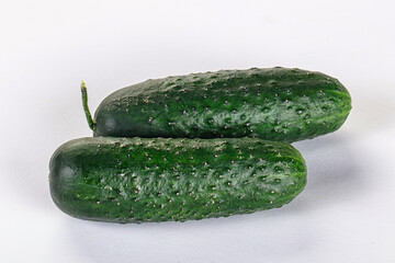 Ripe green raw two cucumbers