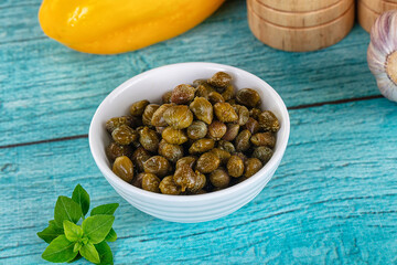 Pickled canned capers in the bowl