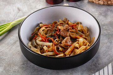 Asian cuisine udon with chicken and vegetables
