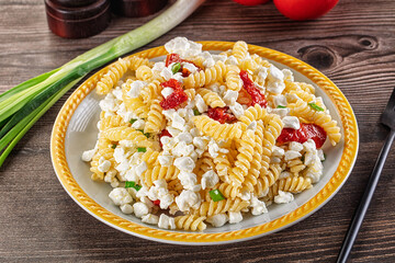 Italian pasta fusili with curd