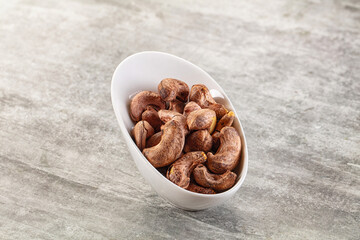 Unpeeled cashew nuts in the bowl
