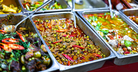 Thai street food sold at Banzaan Fresh Market in Patong, Phuket