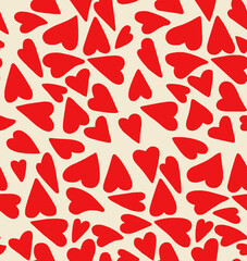 A drawing of red hearts on a light pink background.Seamless drawing.