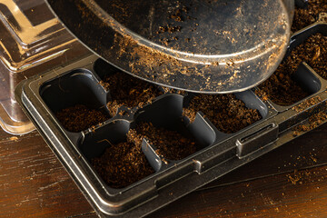 Plastic containers for molde seedlings plants, transplanting plants, plastic pots with soil,