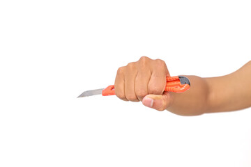 Close-up of a hand gripping an orange box cutter against a stark white backdrop, showcasing...