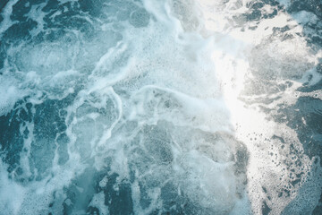 Close-up of foamy water surface with bubbles in hot tub, abstract water texture, relaxing spa atmosphere, clean transparent water movement
