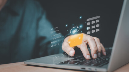 Businessman working on laptop with virtual screen upload backup document management, cloud...