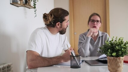 Couple managing domestic finances and bills at home - Powered by Adobe