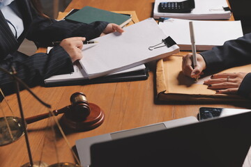 Attractive young lawyer in office Business woman and lawyers discussing contract papers with brass...