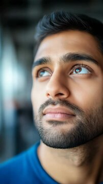 Young male with thoughtful expression in natural light