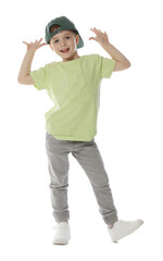 Happy little boy in baseball hat dancing on white background