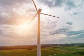 Clean energy windmill under summer clouds