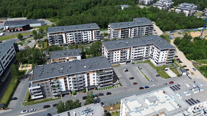 Aerial view modern apartments surrounded by greenery in European