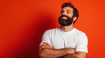 happy man with beard smiling against orange background