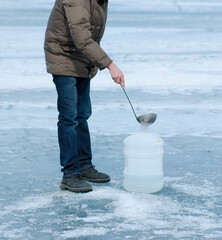 water scooping at Baikal lake