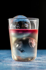 Elegant luxury cocktail in front of dark background