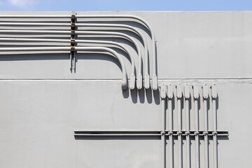 Professional outdoor electrical wiring corner installation in metal conduit connector box.