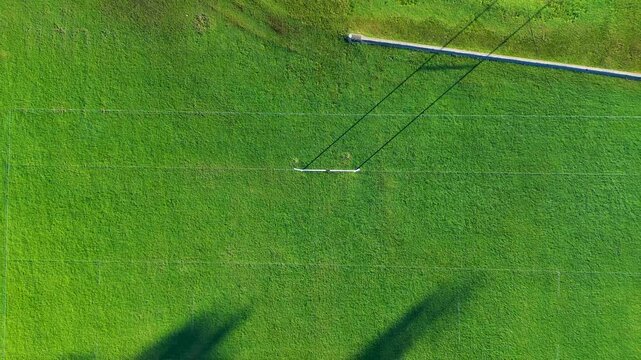 Drone aerial landscape of public rugby league union goal scoring posts with try line on grassy oval fields meadow on Central Coast Australia community local recreation event for competition showground