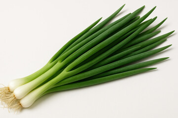 Fototapeta premium Bunch of green onions on white background.