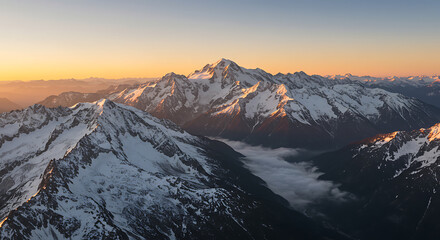 Majestic Sunset Over Snow-Capped Mountains Breathtaking Aerial View