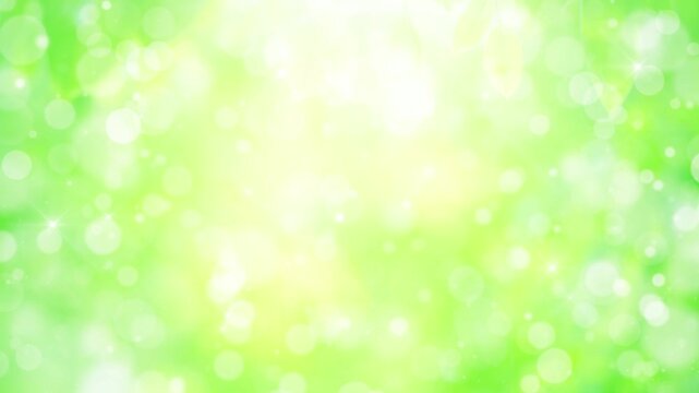 緑　自然　ループ動画　枠　爽やか　玉ボケ　キラキラ　パーティクル　木漏れ日　葉っぱ　Abstract glowing green background.Bokeh lights.Fresh green leaves shining in the sunlight.Loop video.