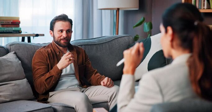 Counseling, talking and man with therapist on sofa for life coaching, support and mental health. Psychology, office and patient listening to learn coping skills, control emotions and personal growth