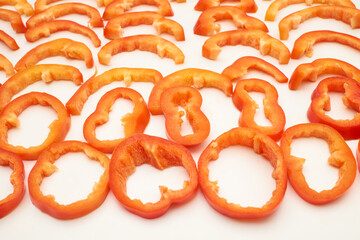 Sliced red sweet ripe pepper cut into circles